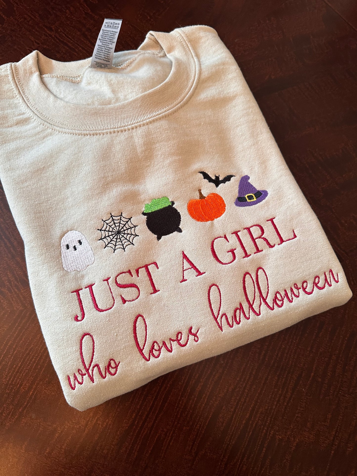 Just a Girl Who Loves Halloween Embroidered Sweatshirt | Cute Fall Crewneck for Women | Pumpkin, Witch Hat & Ghost Halloween Shirt | Cozy Autumn Apparel