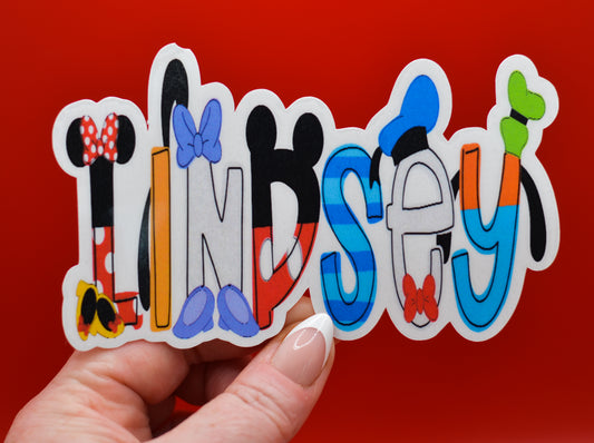 Close-up of personalized Disney stickers showing name customization and glossy waterproof vinyl finish.